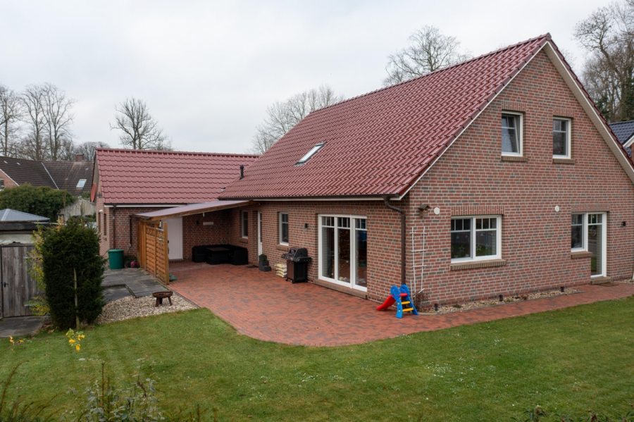 Garten - Neuwertiges Einfamilienhaus mit pflegeleichtem Garten in der „Herrlichkeit Dornum“